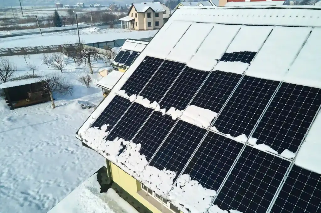 aerial view snow melting from covered solar photovoltaic panels installed house rooftop producing clean electrical energy low effectivity renewable electricity nothern region winter energy2store